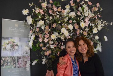 IWCE Friendship - Three women lifting their hands - Photo by Simon Maage on Unsplash